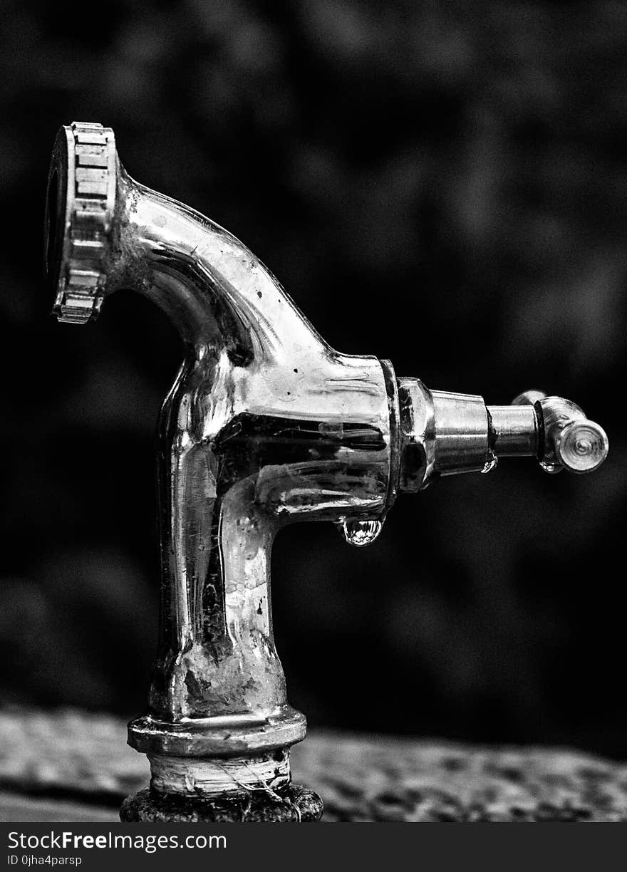 Grayscale Photo Of Stainless Steel Faucet