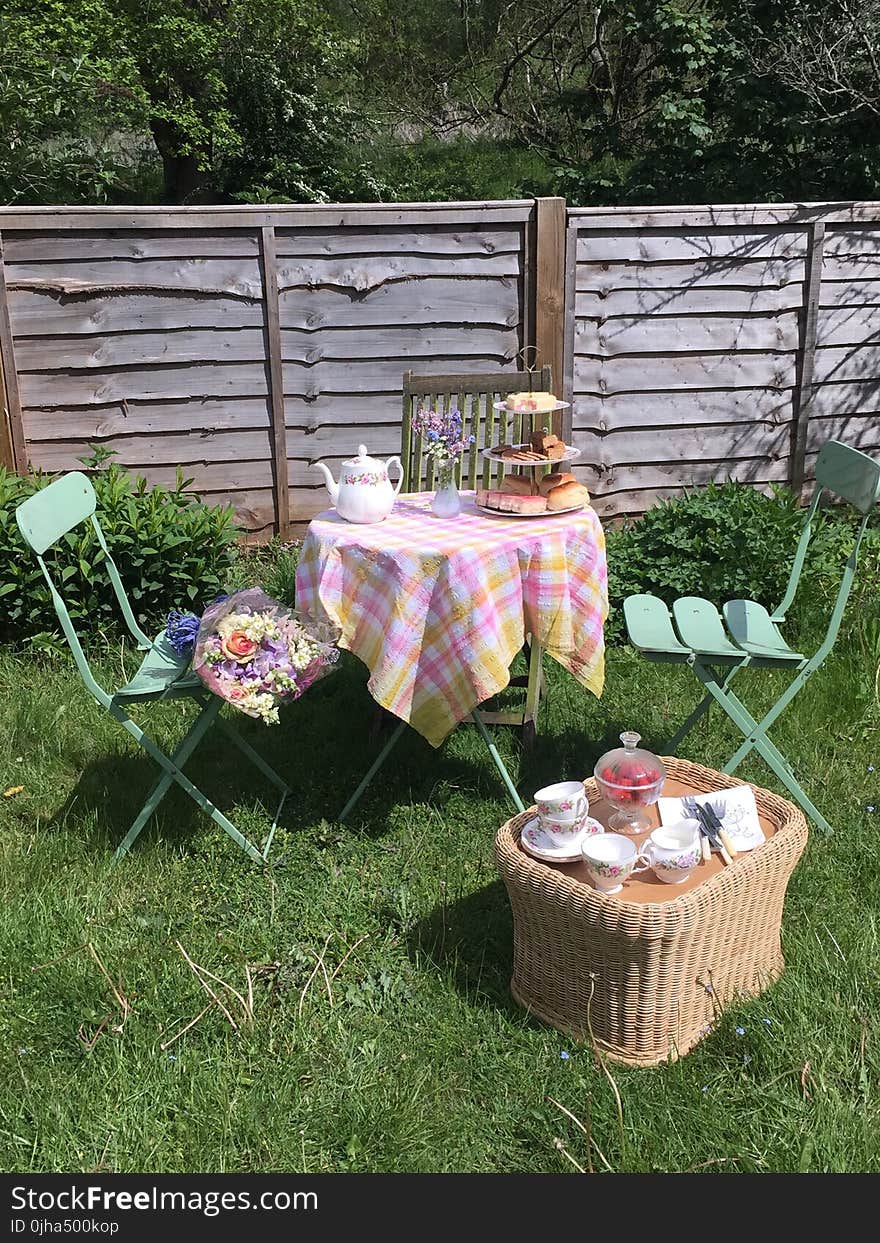 Pink and Yellow 3-piece Patio Set at the Green Grass