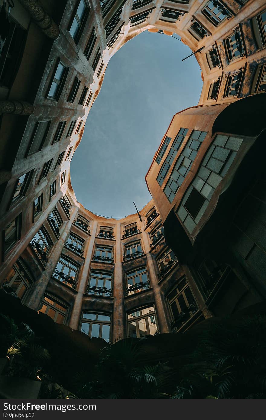 Low-angle Photography of Brown Concrete Building