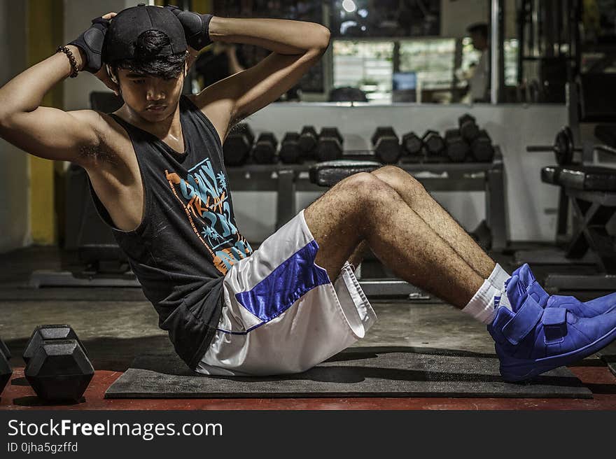 Man In Black Tank Top Inside Gym