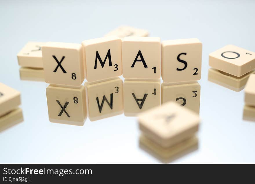 Closeup Photography of Xmas Scrabble Pieces