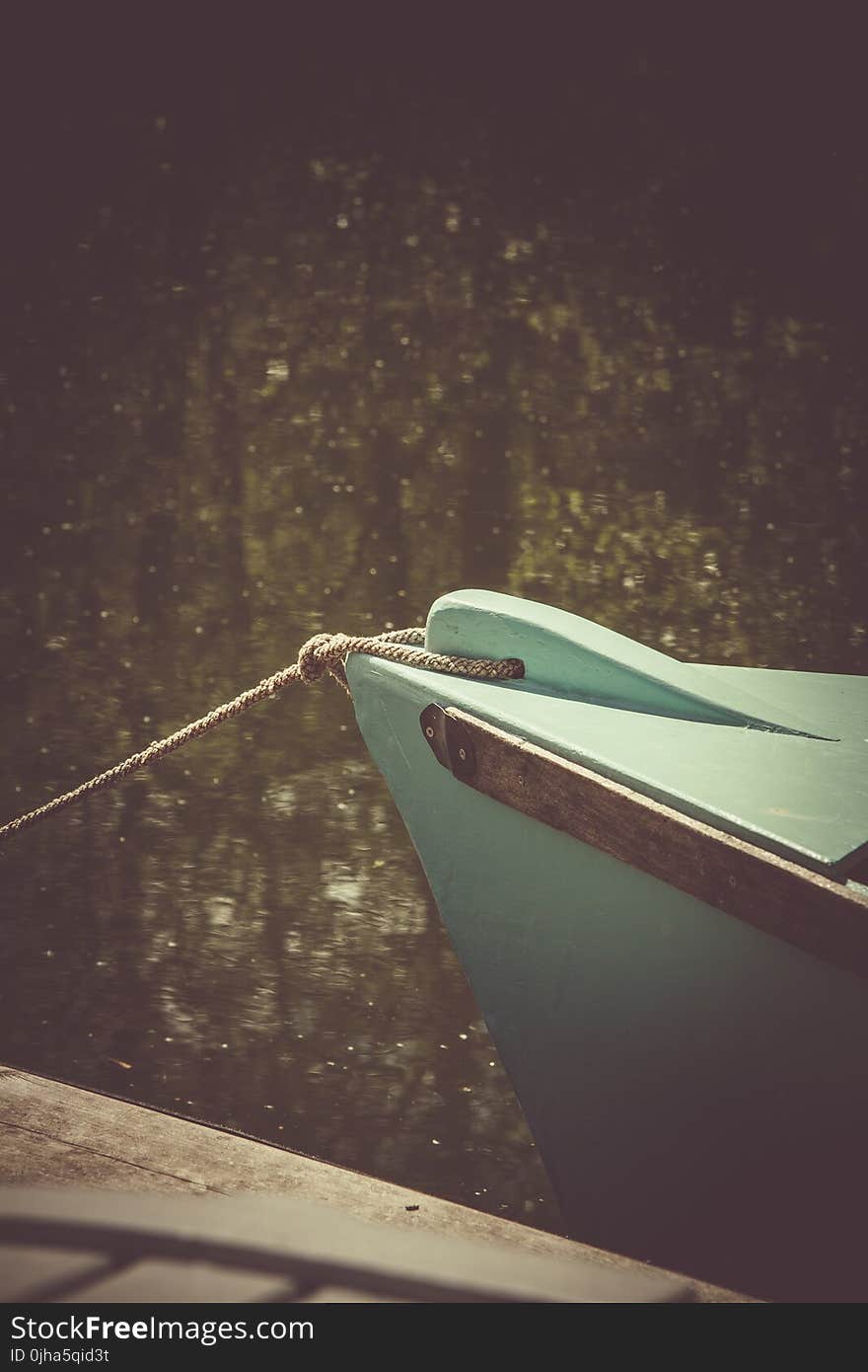 Teal Wooden Boat on Lake