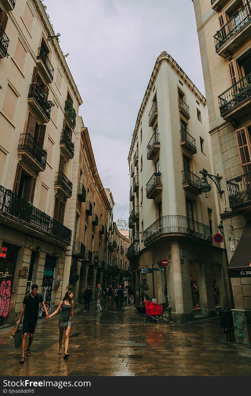 Couple Going Shopping Under the Cloudy Sky