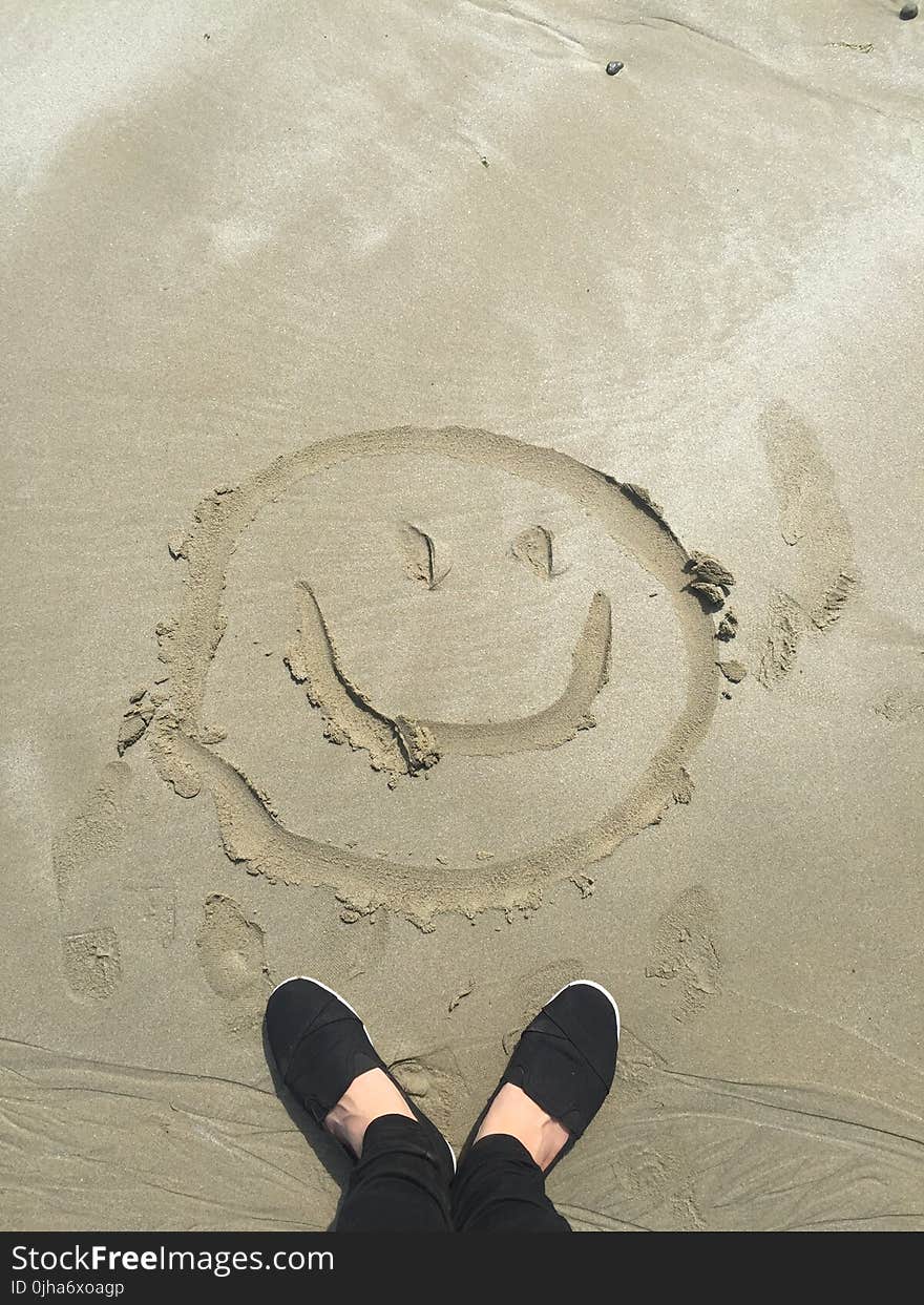 Smiley Drawing on Sand