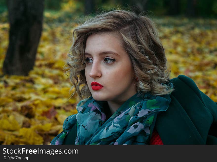 Depth of Field Photography of Woman With Green and White Floral Chiffon Fabric Scarf