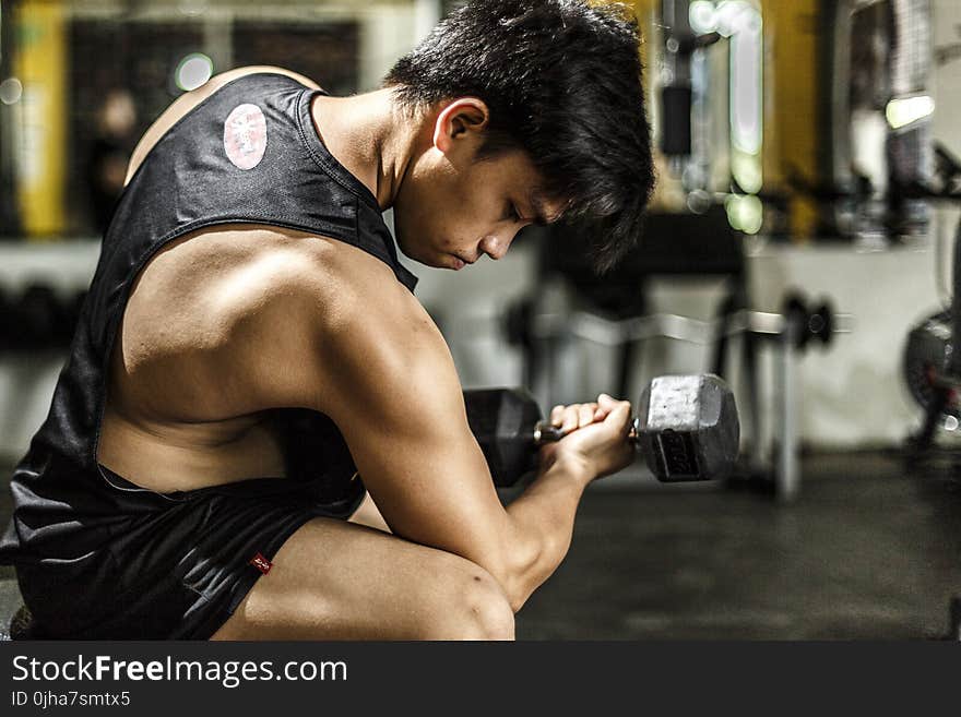 Woman Wearing Black Tank Top Taking Work Out