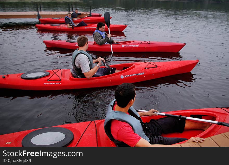 People Riding Kayaks