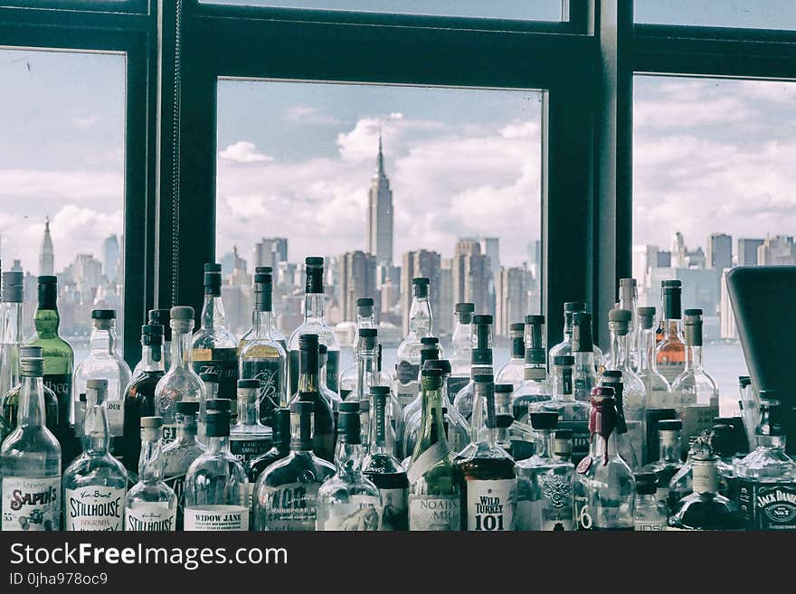 Assorted Bottles Near Windows