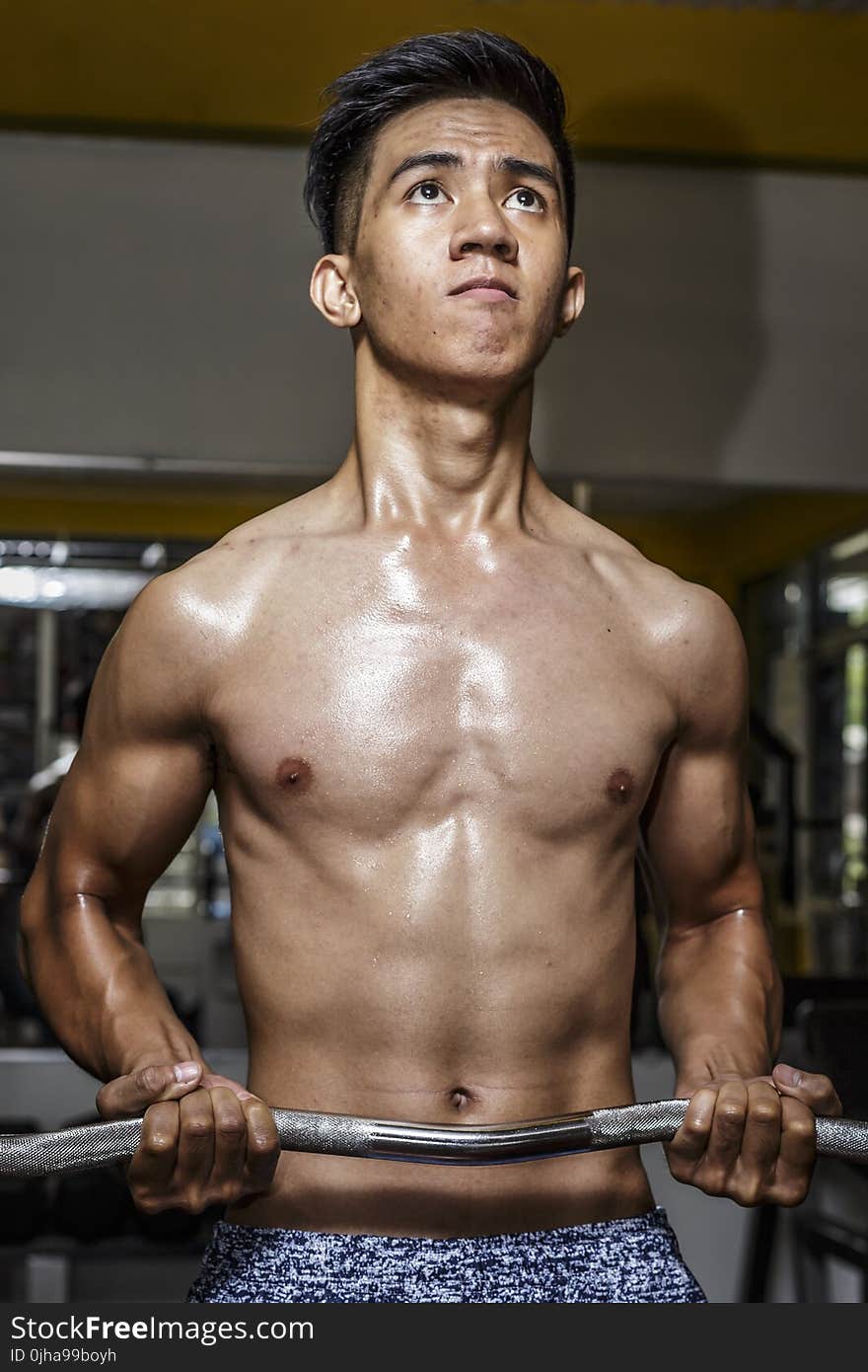 Photography of Man Carrying Ez Barbell