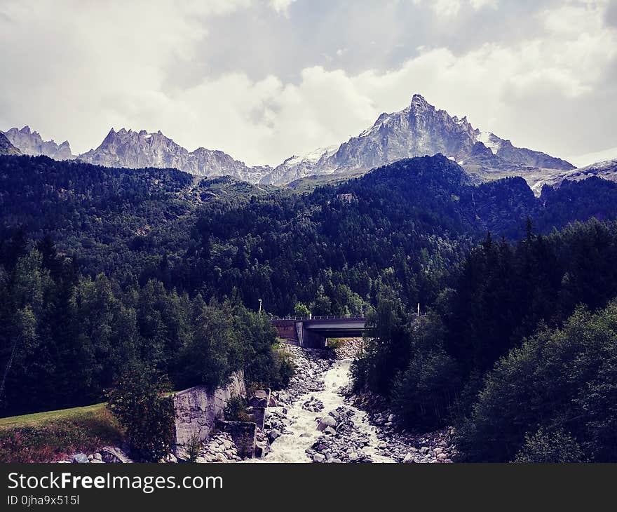 Bridge Near Trees and Mountain Landscape Photo