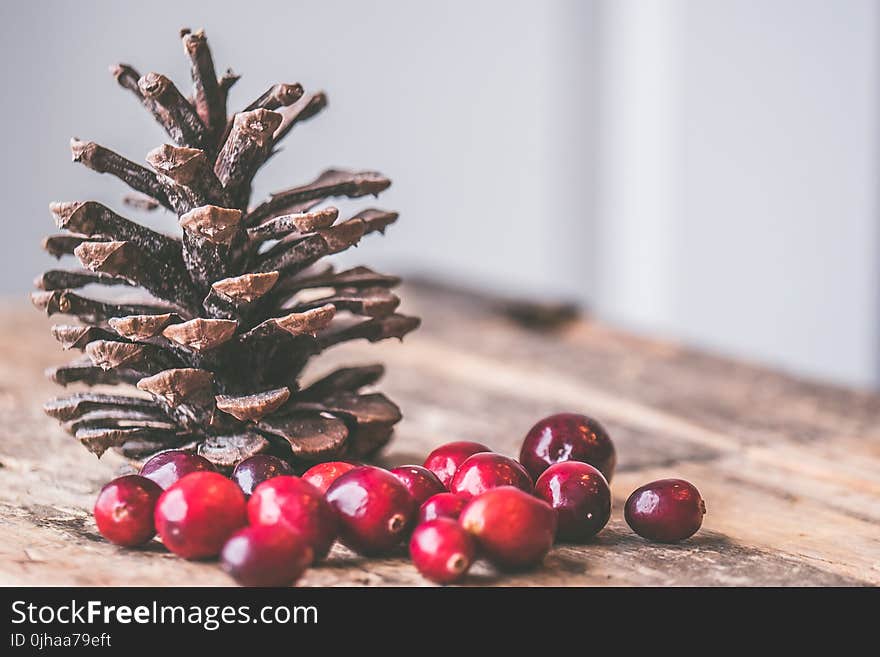 Red Coffee Beans on Top of the Wooden Table