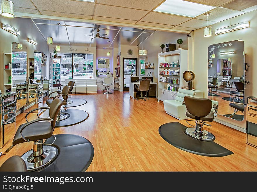 White And Brown Chairs Inside A Salon