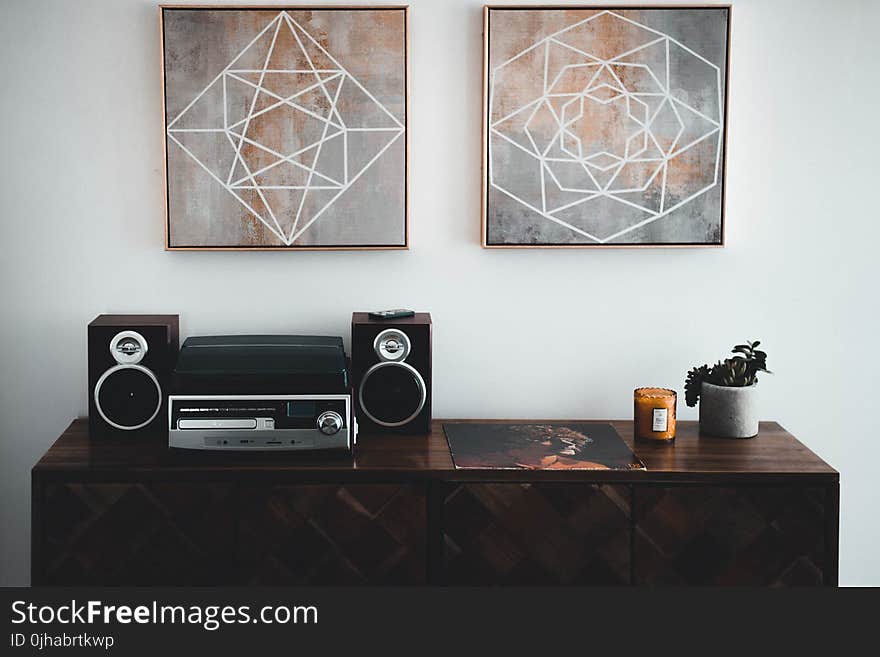 Black Shelf Stereo on Brown Wooden Sideboard