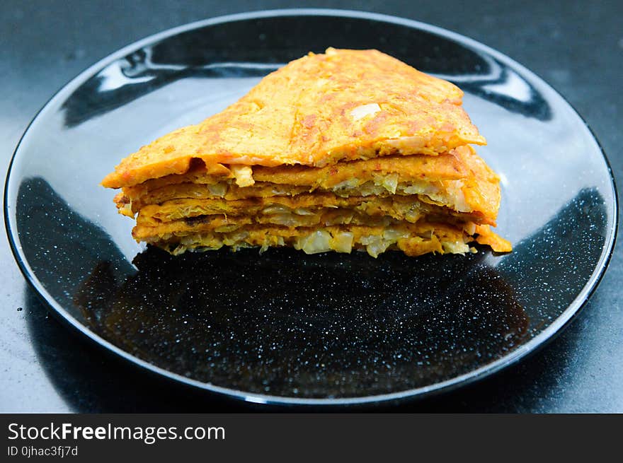 Stack of Pancakes On Round Black Ceramic Plate