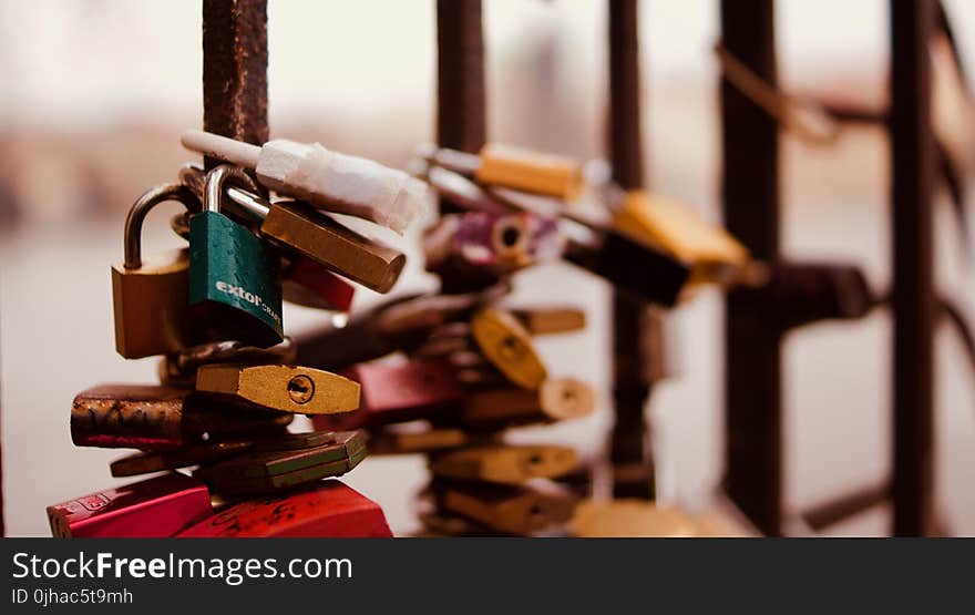 Selective Focus Photography of Padlocks on Fence