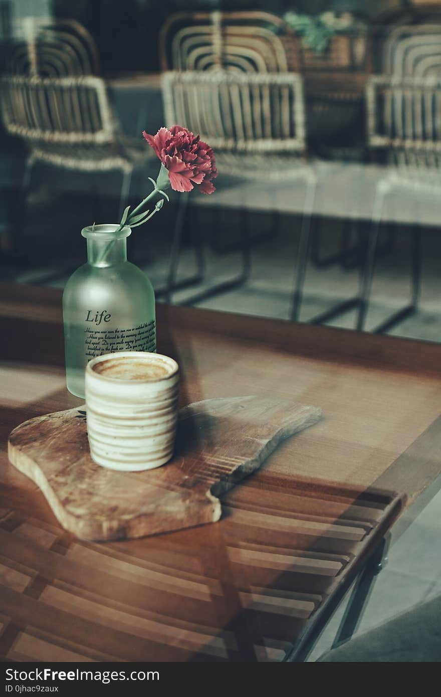 Close-up Photography of Mug and Flower Vase