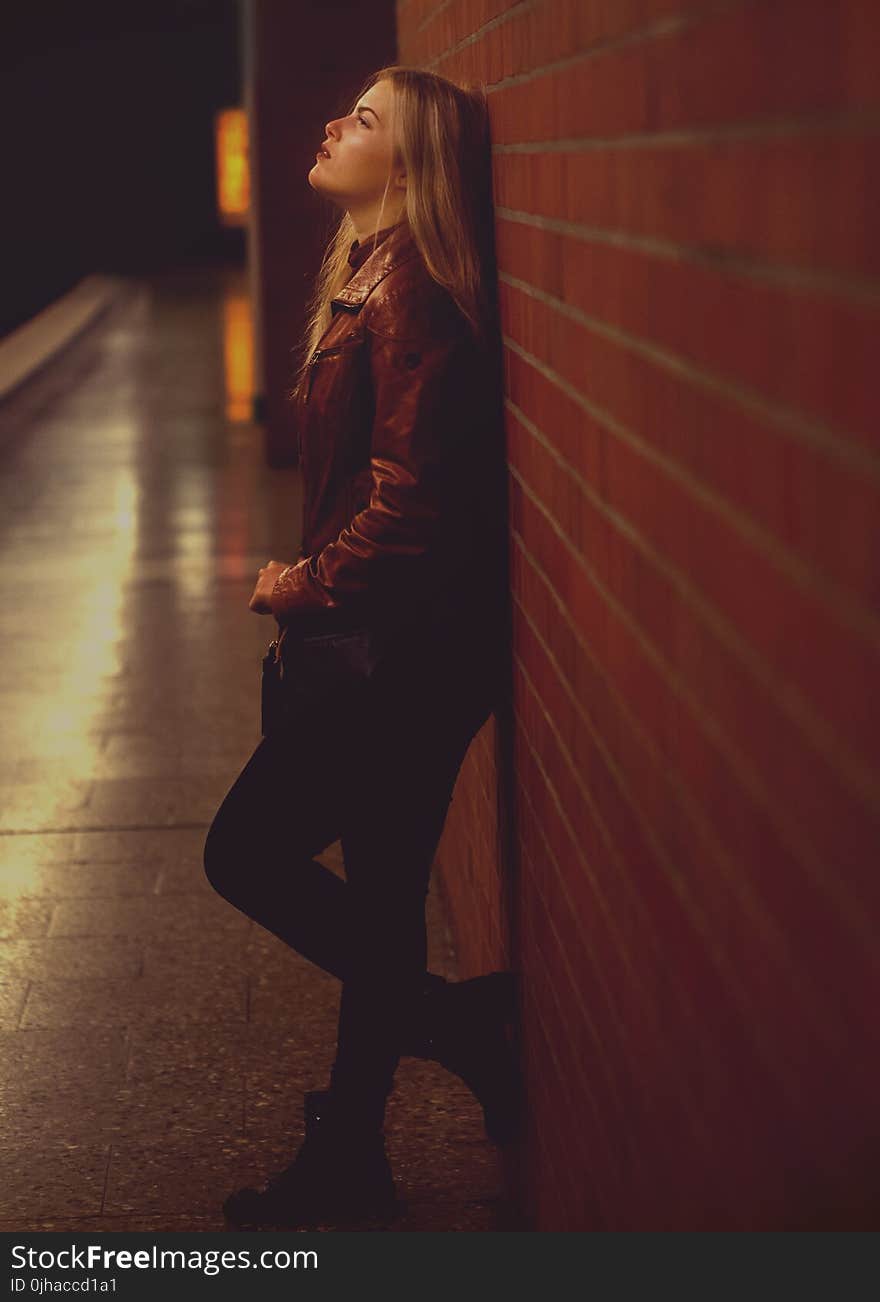 Woman Leaning On Wall