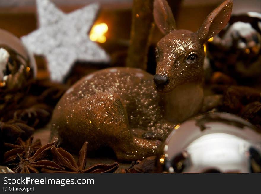 Brown Deer Figurine and White Star Decor