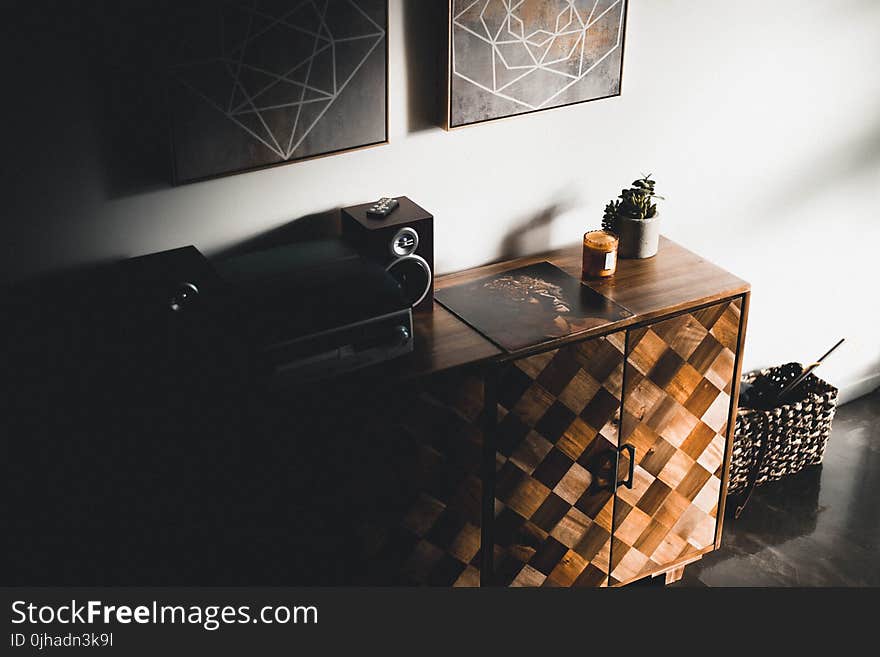 Black Stereo Component on Brown Wooden Dresser Console