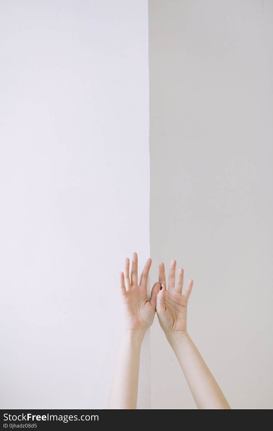 Person Two Hand Leaning on Wall