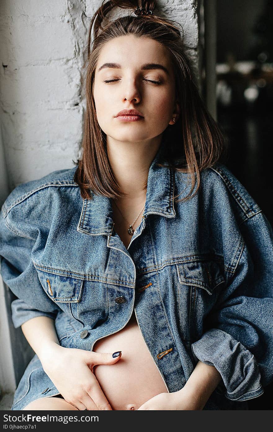 Woman in Blue Denim Button-up Jacket