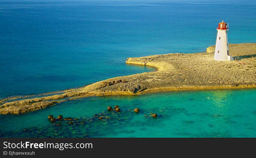 Bird&#x27;s Eye Photography of White Lighthouse on Island