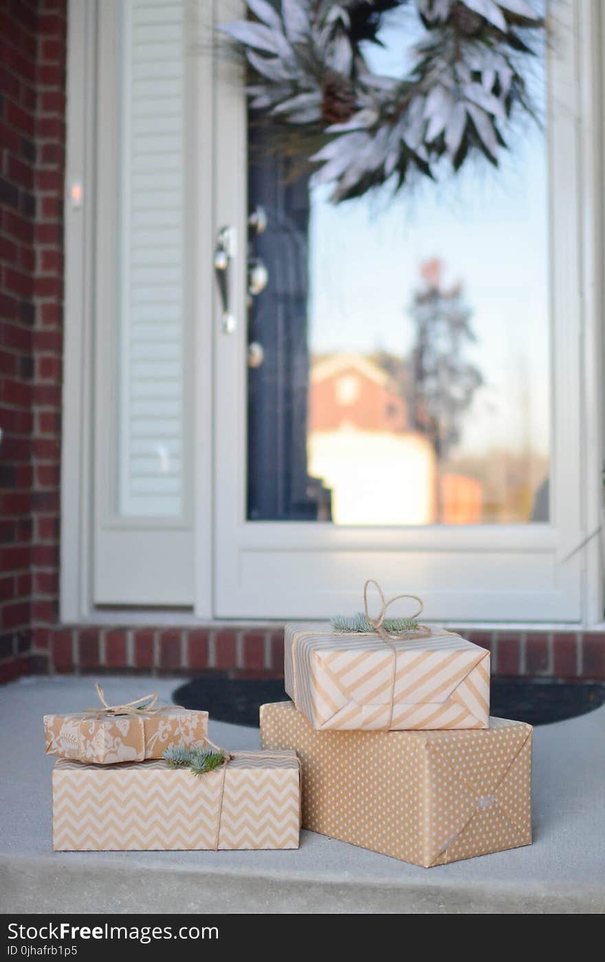 Three Beige Colored Boxes on the Floor