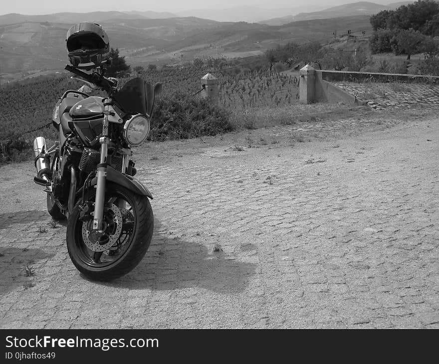 Grayscale Photo of Standard Motorcycle