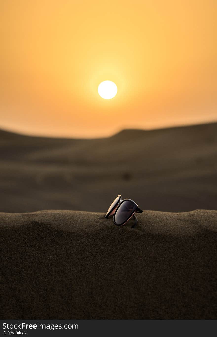 Wayfarer Sunglasses on Sand Tilt Shift Lens Photography