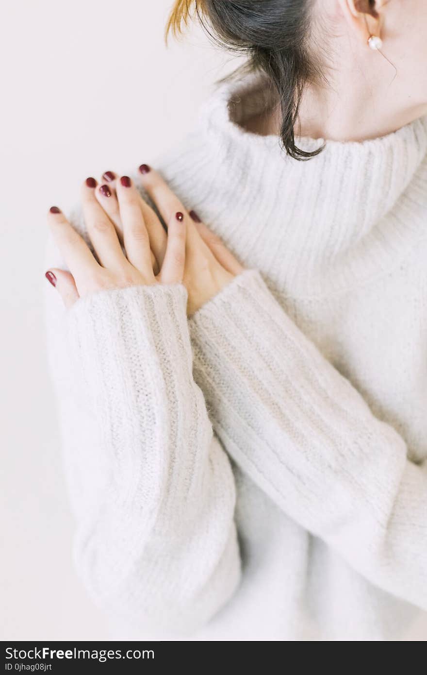 Woman Wearing Turtleneck Sweater in White Surface