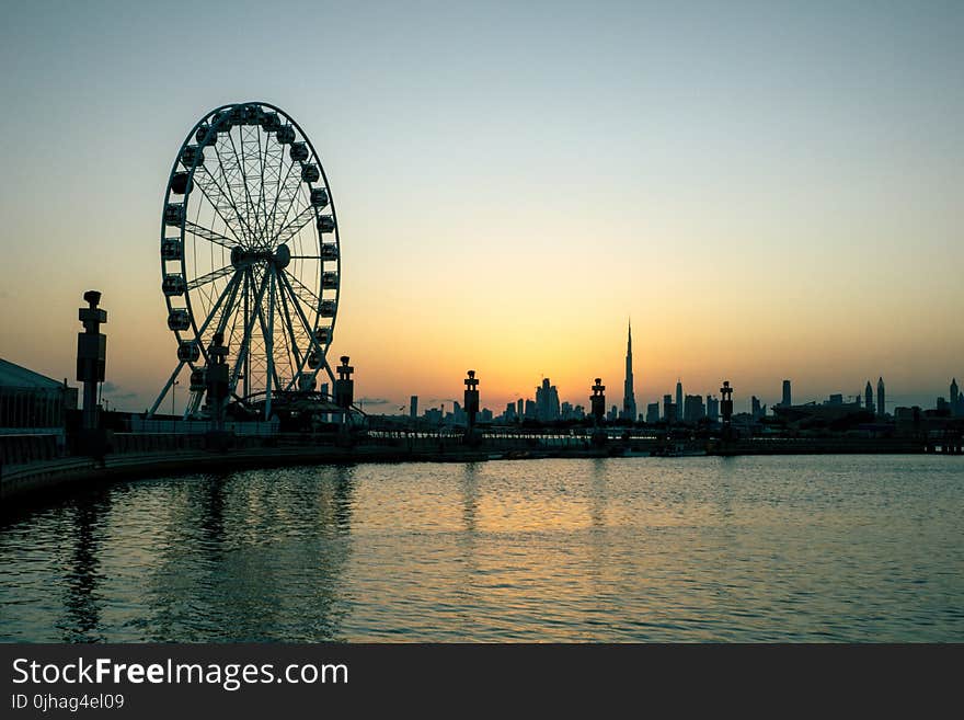 Black Ferris Wheel Near Body of Water