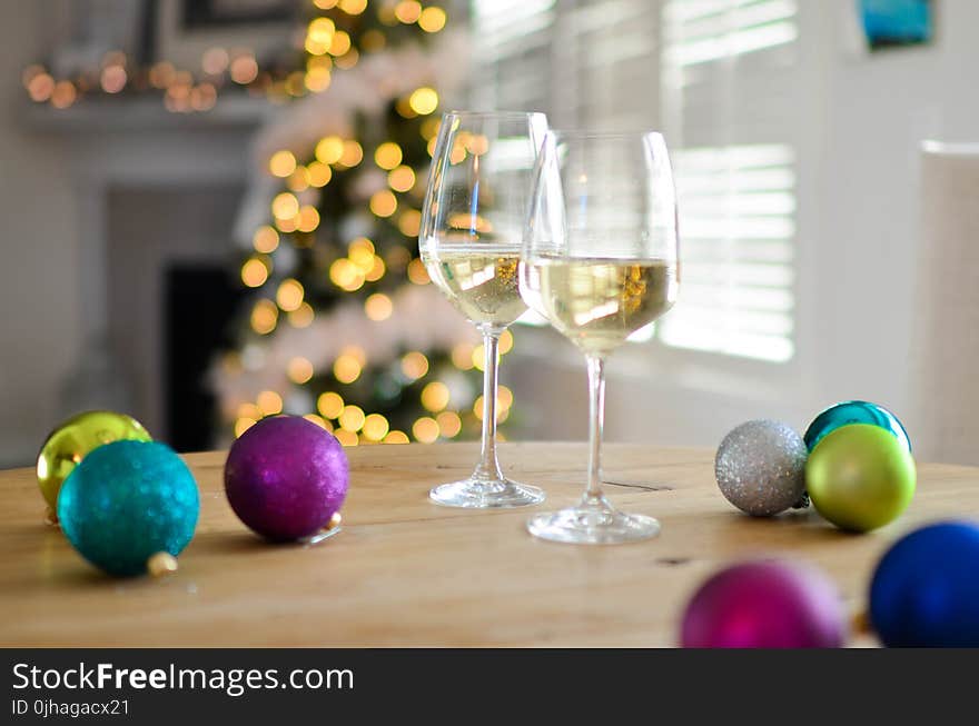 Two Champagne Glasses Near Baubles