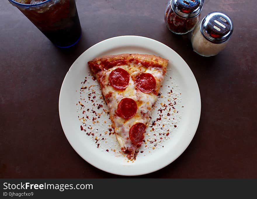 Sliced Pepperoni Pizza on White Ceramic Plate