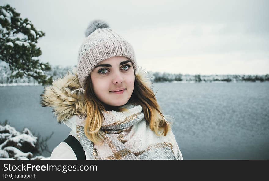 Woman Wearing White Bobble Hat and Jacket