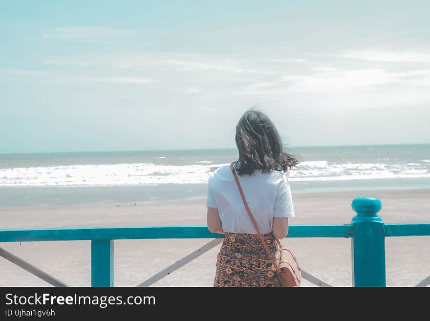 Woman Standing Near Seashore