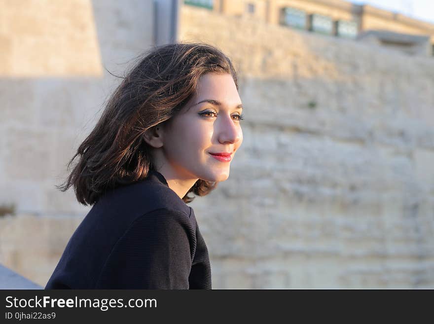 Woman Wears Black Coat and Red Lipstick