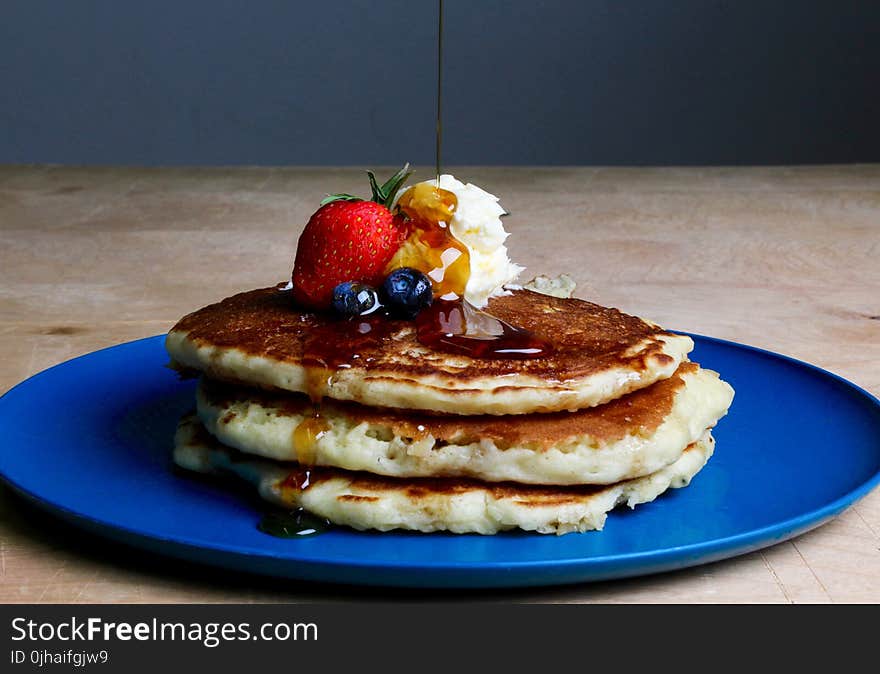 Pancakes With Strawberry, Blueberries, and Maple Syrup