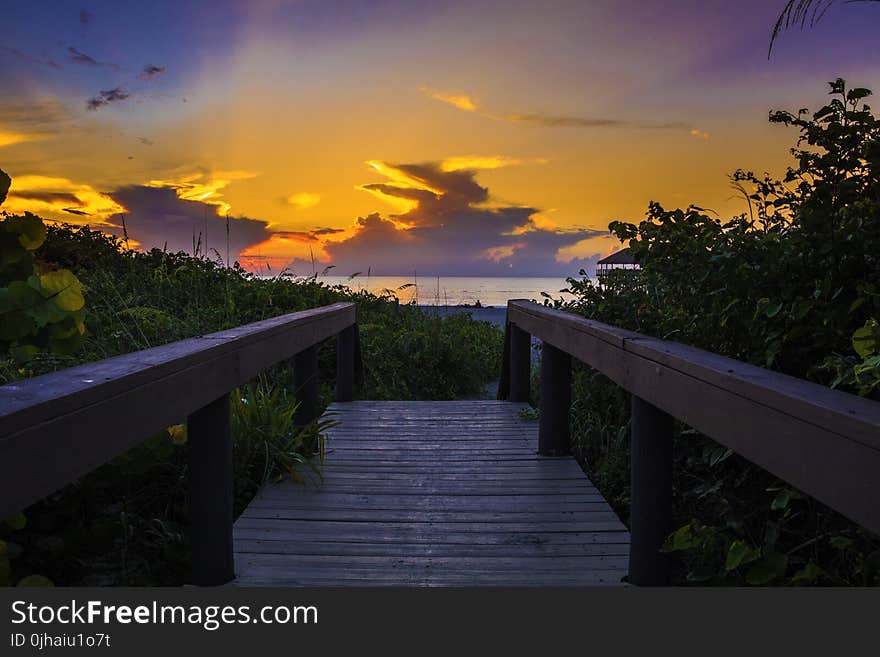 Photography of Wooden Bridge During Sunset