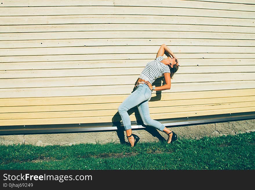 Woman in Blue Jeans and Stripes Crop Top