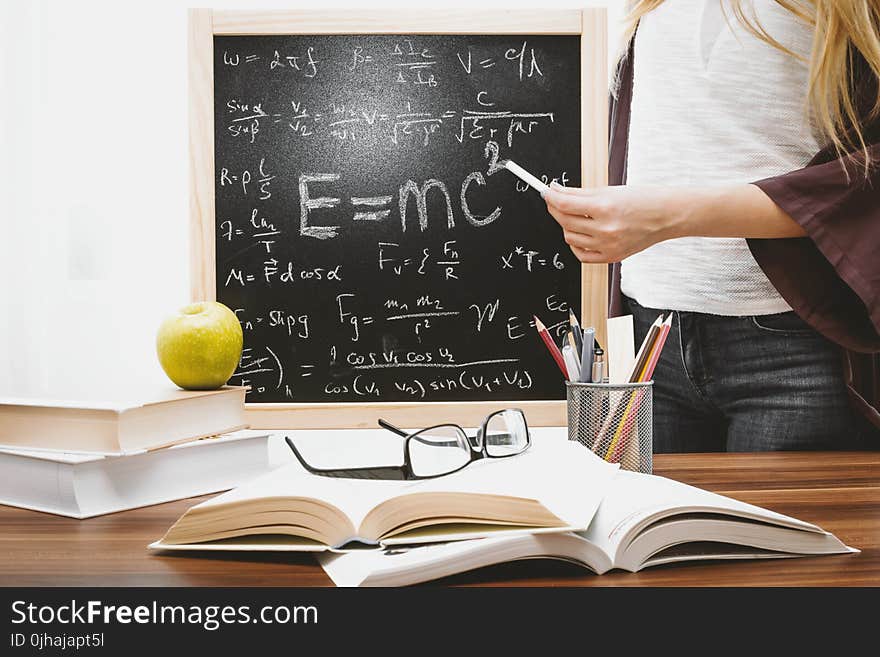 Woman Illustrating Albert Einstein Formula