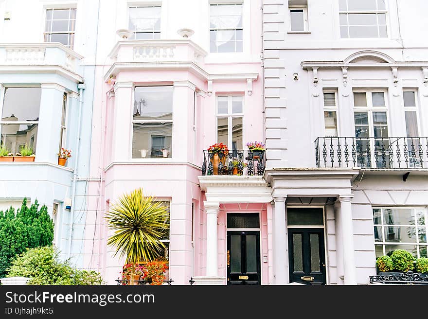 Architectural Photography of White and Pink High-rise Building