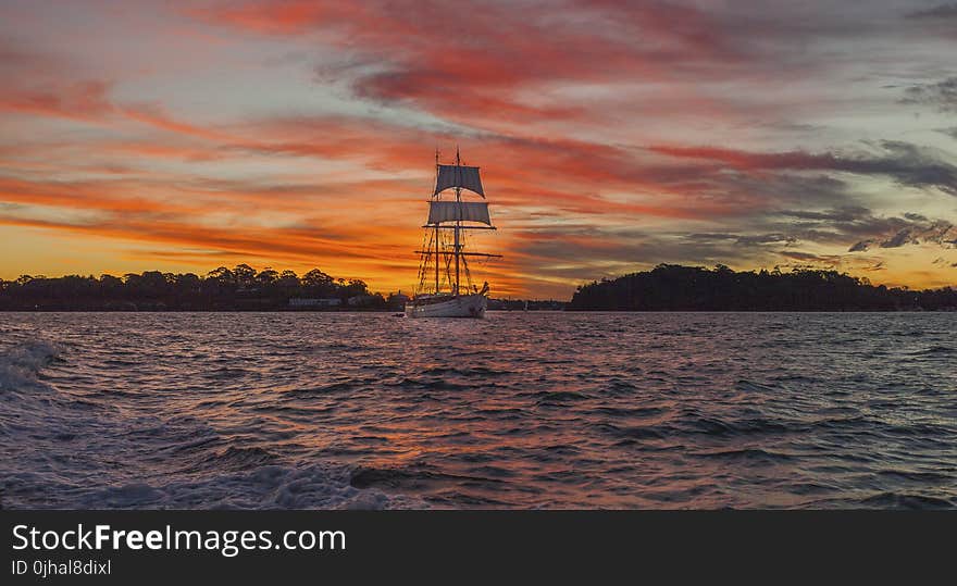 White Boat on Sea during Golden Time