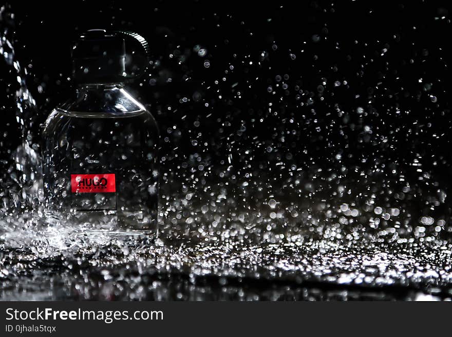 Close-up Photo of Water Drops on Bottle