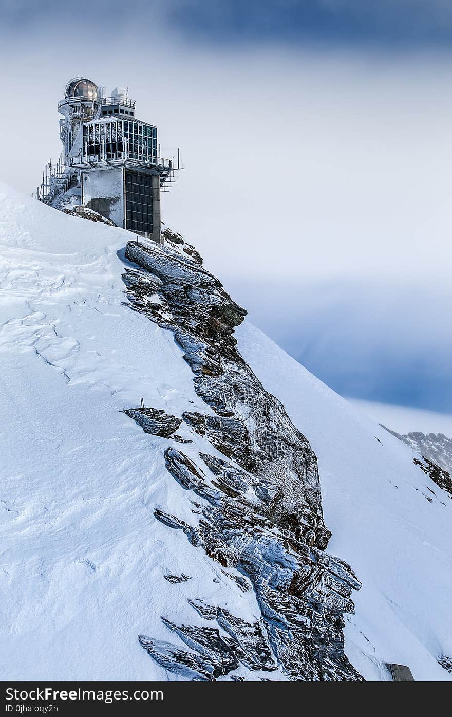 Photo of a Building in a Snowy Hill