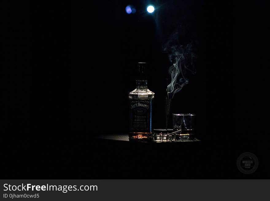 Closeup Photo of Liquor Bottle Against Black Background