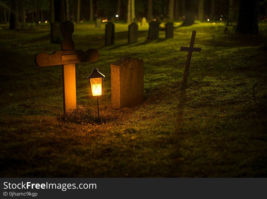 Selective Focus Photo of Cemetery Lantern