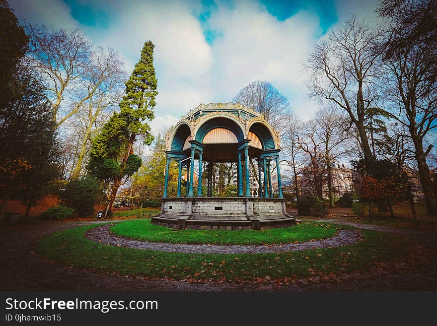 White and Blue Dome Shed in Middle of Trees Photo