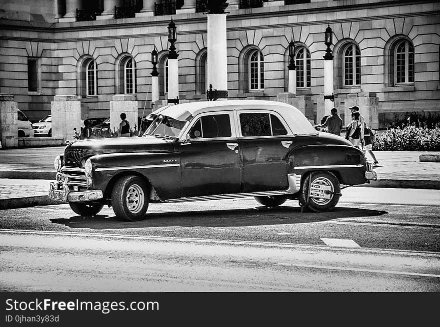 Grayscale Photo of Classic Chevrolet Sedan