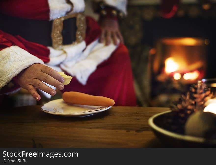 Person Holding Cheese Putting on White Plate