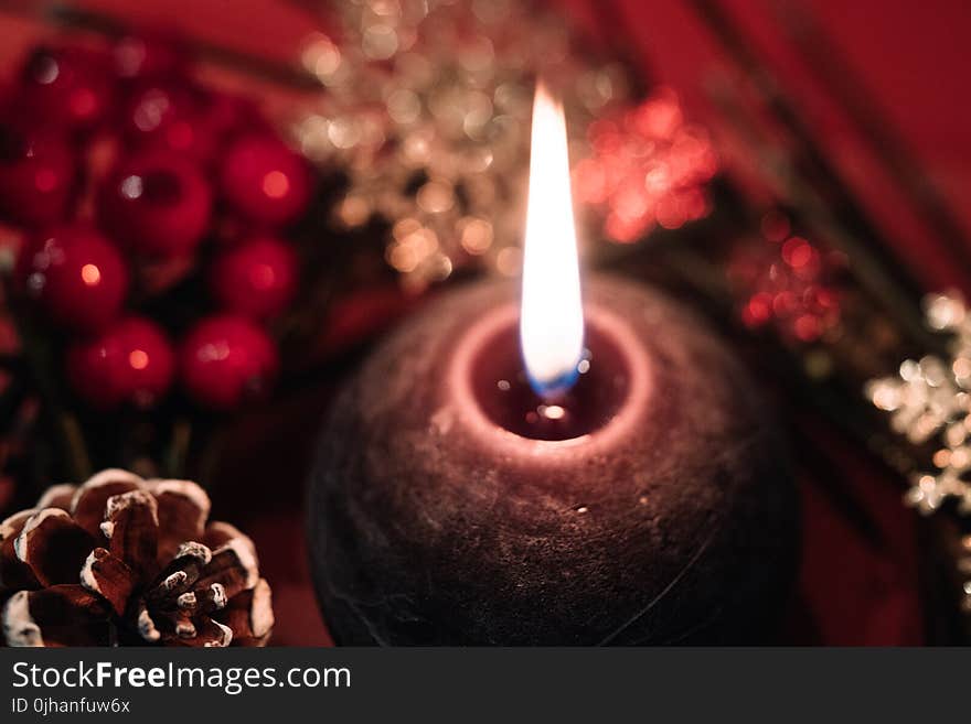 Lighted Black Round Candle